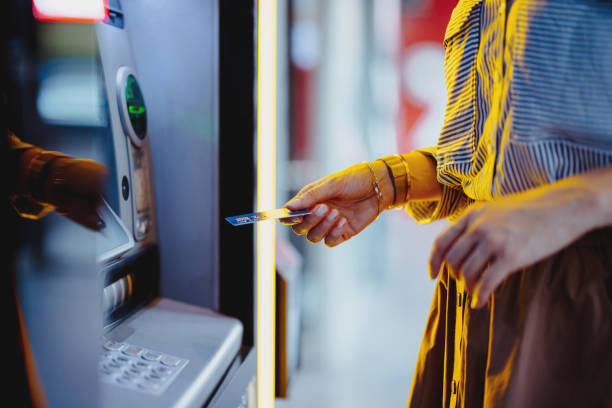 istock Close Up Photo Of Woman Hands Using ATM Machine 1431478224