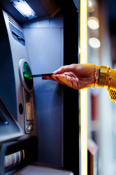 istock Close Up Photo Of Woman Hands Using ATM Machine 1431478227