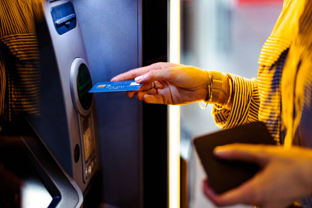 istock Close Up Photo Of Woman Hands Using ATM Machine 1431478234