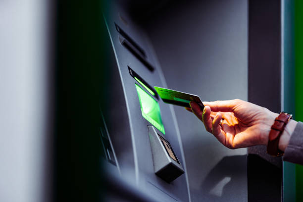istock Close Up Photo Of Woman Hands Using ATM Machine 1431478274