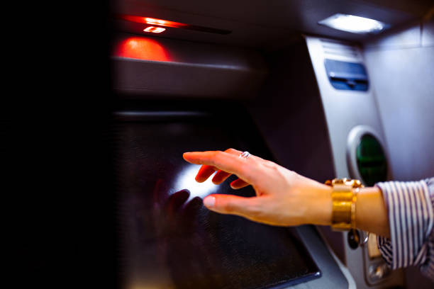 istock Close Up Photo Of Woman Hands Using ATM Machine 1431478281