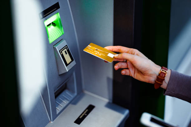 istock Close Up Photo Of Woman Hands Using ATM Machine 1431478285