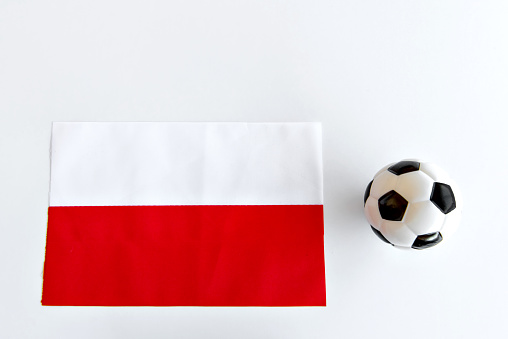 Soccer ball and Poland flag on white background