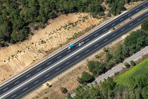 trucks moving on highway aerial shot