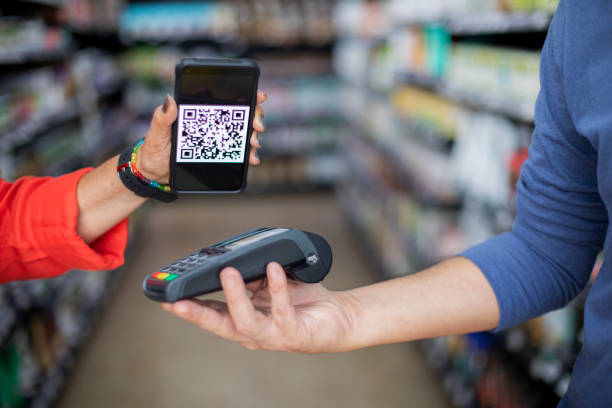 istock woman paying with QR code, at the supermarket 1431499988