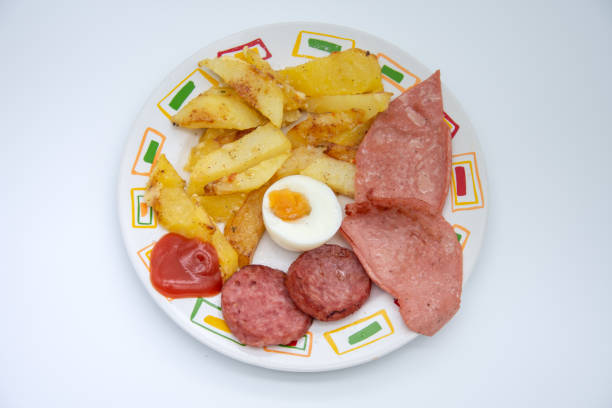 fried potatoes with salami and parizer