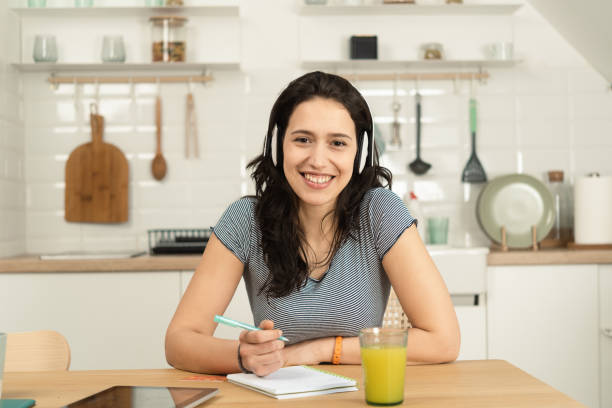 istock Portrait of a happy student enjoying music while learning 1431512726