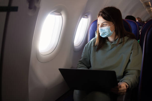 istock Girl traveling by a plane and watching something on laptop 1431512849