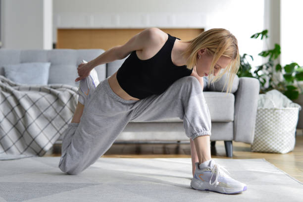 istock Woman doing stretching exercise at home. 1431512987