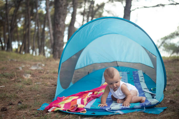 istock A toddler sits in a camping tent during the day 1431513013