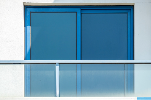 blue window on white wall