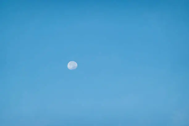 Photo of moon in blue sky