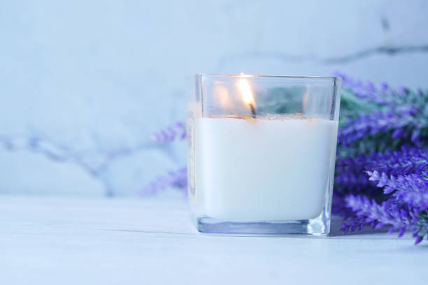 istock Burning scented candles for relax on black background 1431519323