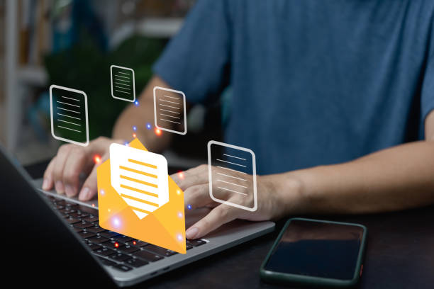 istock businessman using computer laptop checking email icon online or sending mail to partner and customer on web with virtual interface technology concept. 1431548290