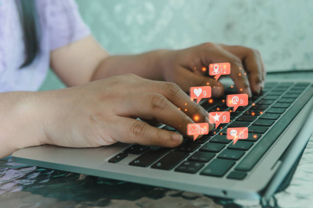 istock Woman using computer laptop social network icons and working internet digital marketing email. 1431548311