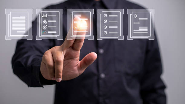 istock Paperless workplace ideas, e-signing, electronic signature, document management. A businessman signs an electronic document on a digital document on a virtual screen 1431548811