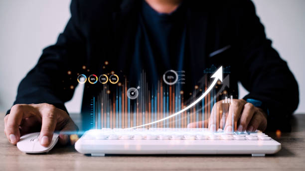 istock people using tablets And using his finger to touch the screen With a business graph showing up in a virtual screen.New startup ideas and business growth concept. 1431548904