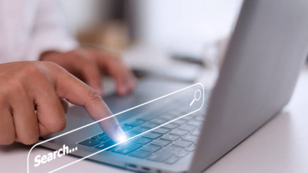 istock People hand using laptop or computor searching for information in internet online society web with search box icon and copyspace. 1431548976