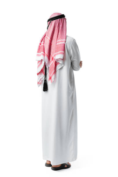 istock Back view of an Arab man standing on white isolated background 1431551690