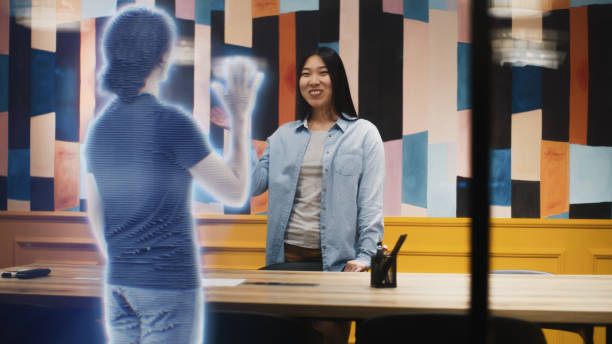 istock Asian girl talks on call with friend using augmented reality software VFX holographic effect 1431554155