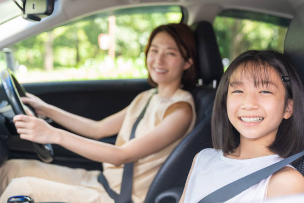 istock asian mother and daughter in a car 1431559576