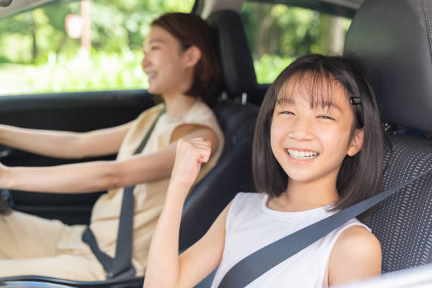 istock asian mother and daughter in a car 1431559880