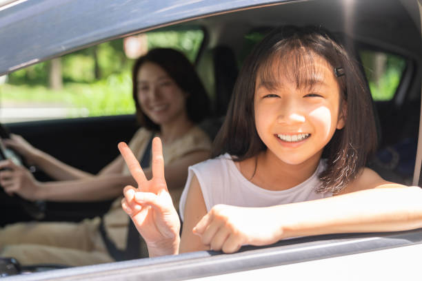 istock asian mother and daughter in a car 1431559932