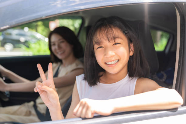 istock asian mother and daughter in a car 1431559979
