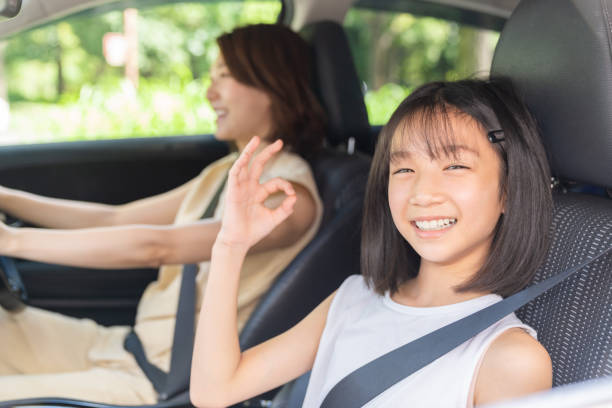 istock asian mother and daughter in a car 1431559994