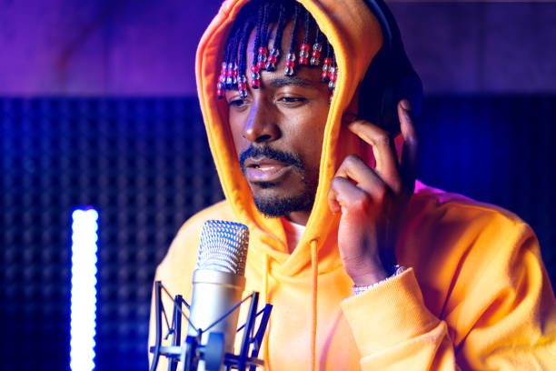 istock Young African performer recording his new track in recording studio 1431560250