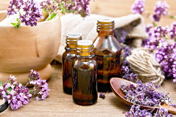 istock Oil with oregano on wooden board 1431563766
