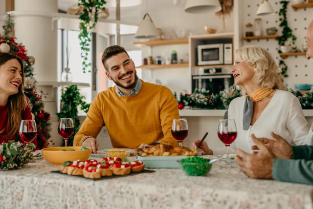 istock Family talking and toasting on Christmas dinner at home 1431565720