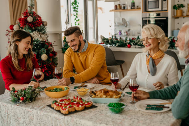 istock Family talking and toasting on Christmas dinner at home 1431565887