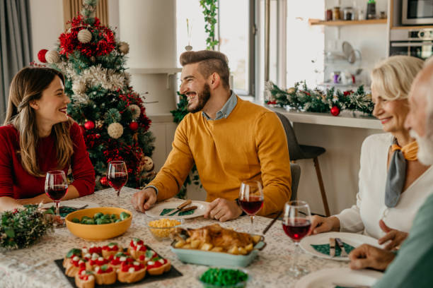 istock Family talking and toasting on Christmas dinner at home 1431565893