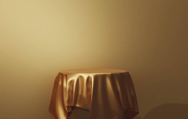istock Round podium base with gold silk on luxury golden abstract background 1431573477