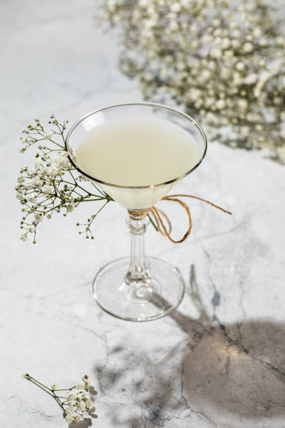 istock Glass of lemon drop martini with splash isolated on white 1431575154