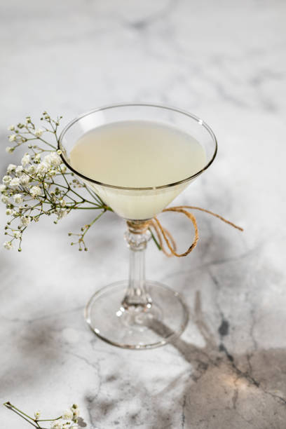 istock Glass of lemon drop martini with splash isolated on white 1431575160