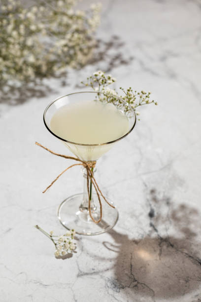 istock Glass of lemon drop martini with splash isolated on white 1431576064