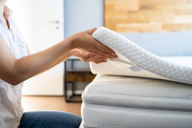Mattress Topper Being Laid On Top stock photo