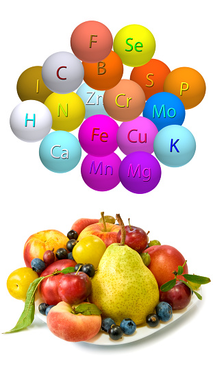 The image of fruits and trace elements in the form of balls with the designation of a trace element on a white background. 3D-rendering