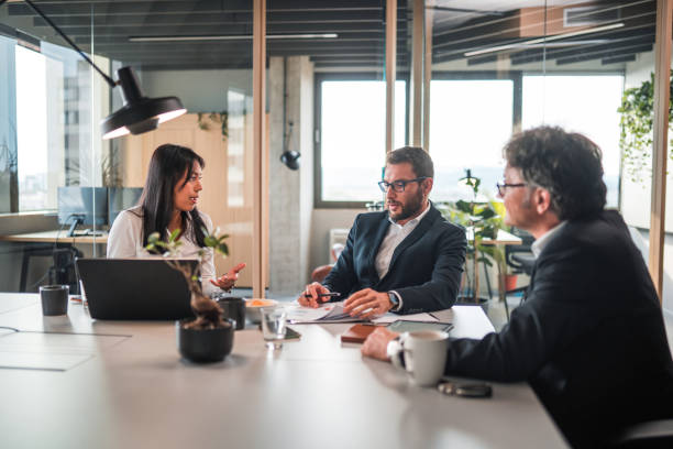 istock Mixed Age Range Financial Advisors Working Together For A Corporate Client 1431581227