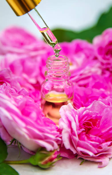 istock Rose essential oil in a small bottle. Selective focus. 1431589268