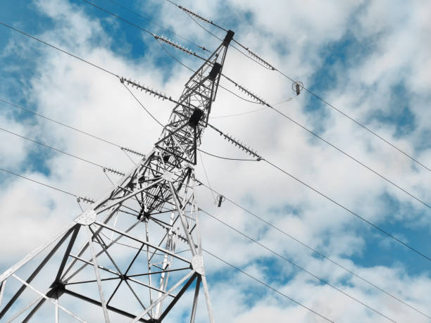 istock Tower of Electrical power lines on blue cloudy sky background 1431589453