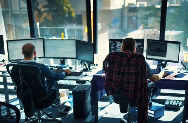 Photo of Software developers at the office.