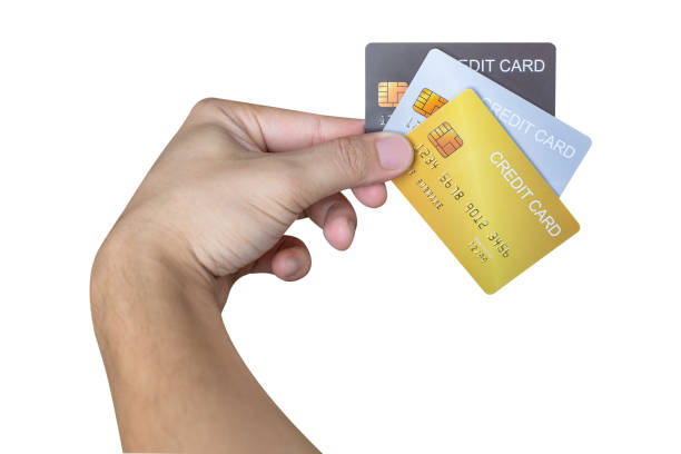 istock Hand holding credit card isolated on white background. 1431594056