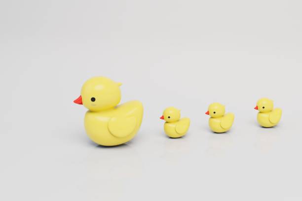 istock a large rubber duck with small ducks of yellow color on a white background. 3D render 1431595719