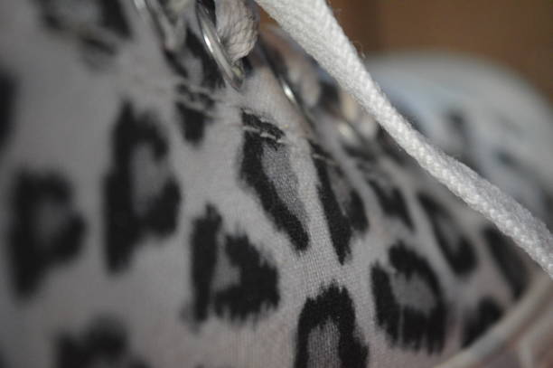 a white shoe with a giraffe's skin pattern
