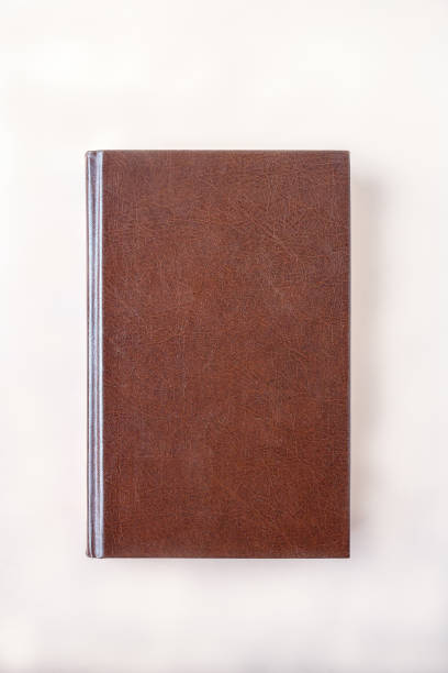 istock one book lies on the table, mockup 1431600216