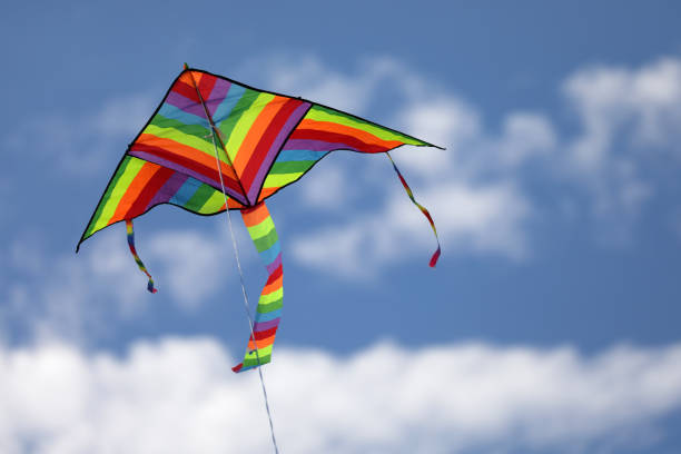 istock kite with color of   rainbow flying free 1431602915