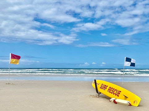 A red flag. Warning sign on the beach